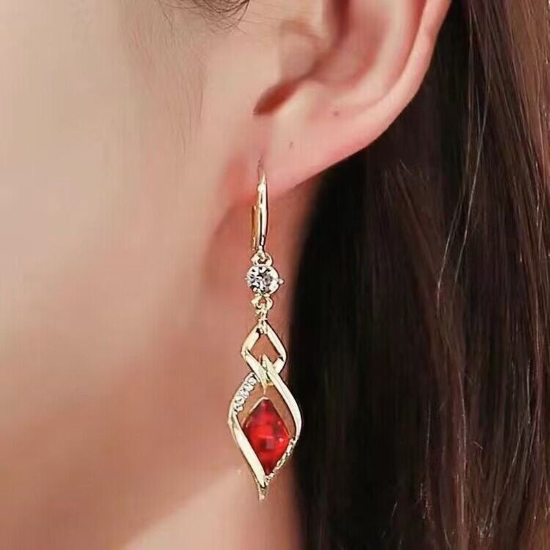 Red Crystal Twisted Geometric Drop Earrings — Gold Tone with Crystal Accent