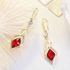 Red Crystal Twisted Geometric Drop Earrings — Gold Tone with Crystal Accent